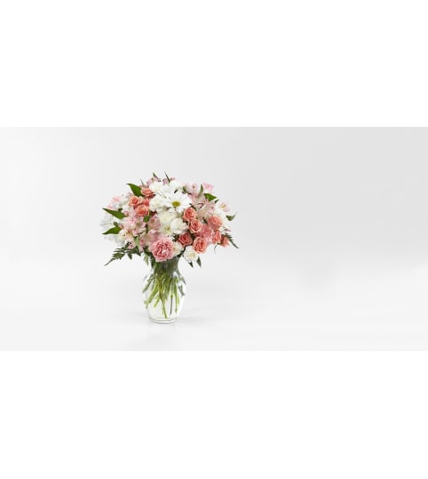 BLUSHING SURPRISE. An arrangement by Novak's Flower Shoppe.