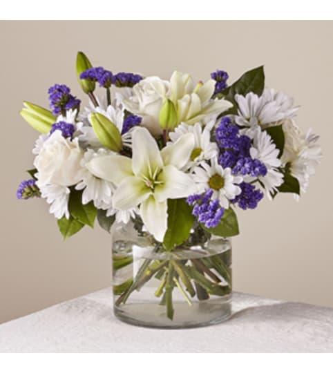 Beyond Blue Bqt Clear. An arrangement by Petals and Co..