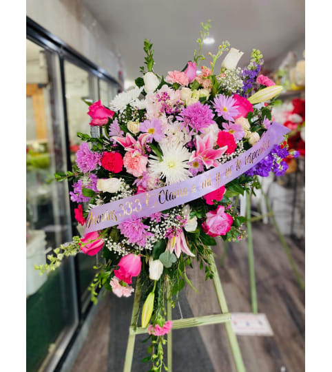 Spray Lilac. An arrangement by Geni's Florist and Gifts.