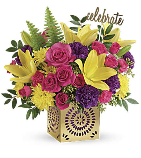Teleflora's A Colorful Celebration. An arrangement by Sueppel's Flowers.