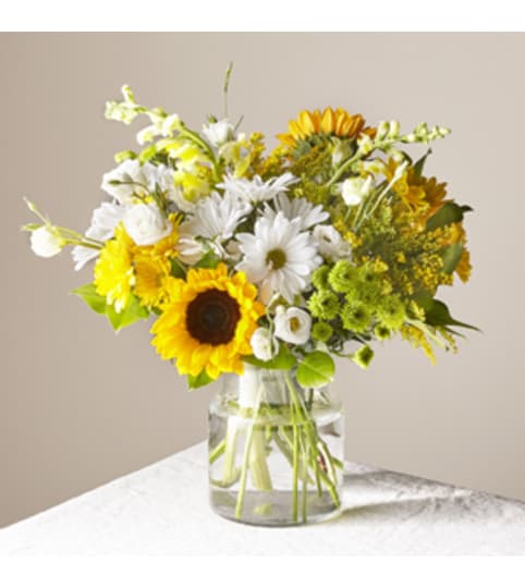 CGY FTD Hello Sunshine. An arrangement by Blossoms On The Trail.