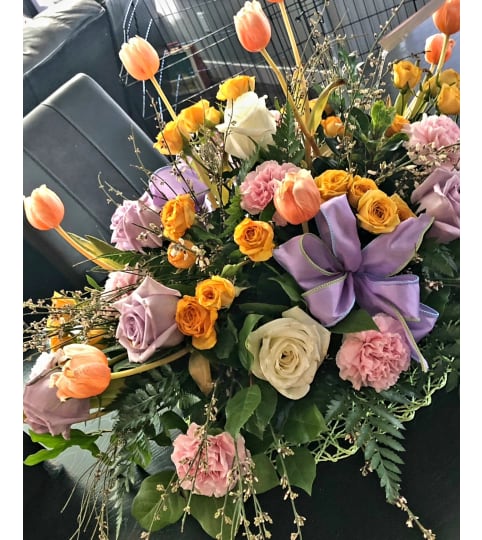 WOW MOM THIS MOTHER'S DAY BOUQUET. An arrangement by A Loving Touch Florist.