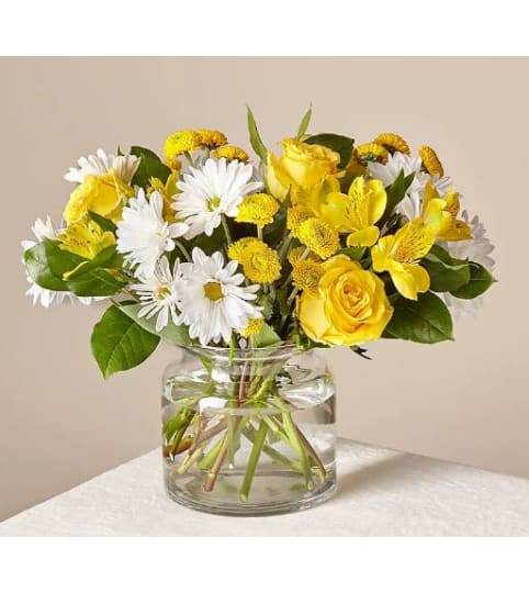 SOME SUNSHINE. An arrangement by Geni's Florist and Gifts.