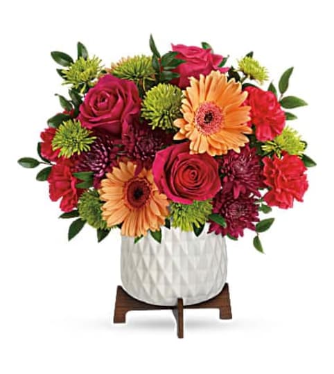 MID MOD BRIGHTS FLOWERS. An arrangement by Triple A Florist.
