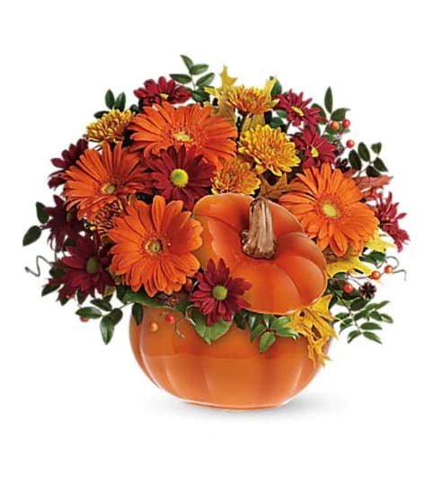 Teleflora's Country Pumpkin Flower Arrangement. An arrangement by Triple A Florist.