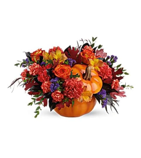 Teleflora's Hauntingly Pretty Pumpkin. An arrangement by Triple A Florist.