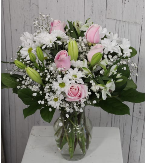 Arriving in Style with Roses. An arrangement by Avenida Flowers.