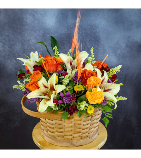 Autumn Harvest Basket. An arrangement by Conny's Flower Shop.