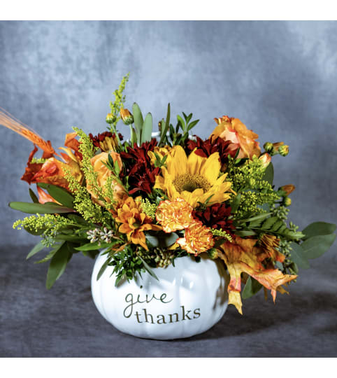 Give Thanks White Pumpkin. An arrangement by Conny's Flower Shop.