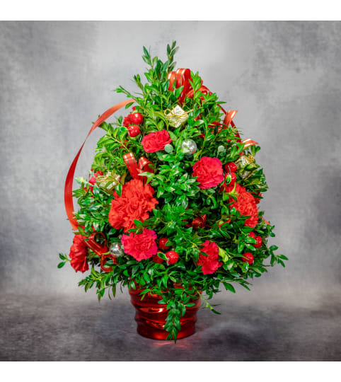 Christmas Tree Centerpiece by Conny's Flower Shop. An arrangement by Conny's Flower Shop.