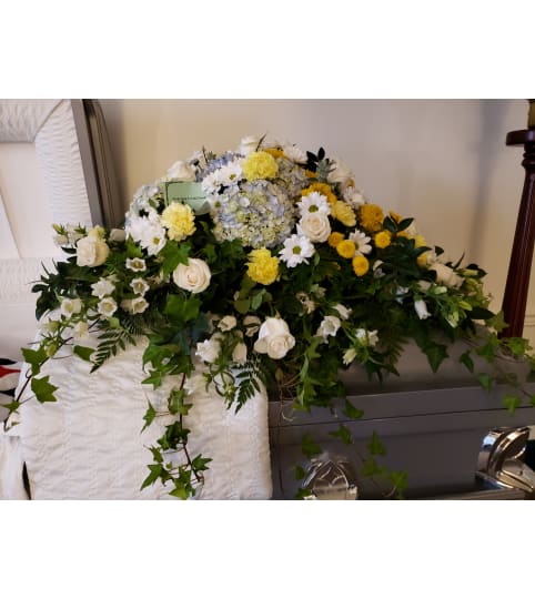 Garden Style Casket Spray. An arrangement by Flowers By Fiore.
