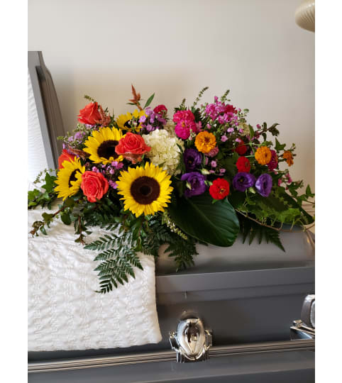Gathered Garden Style Casket Spray. An arrangement by Flowers By Fiore.