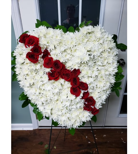 Broken Heart with a Rose break. An arrangement by Flowers By Fiore.