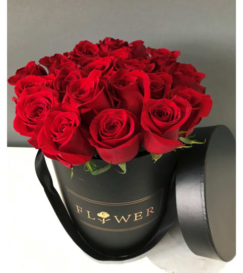 Red Roses Deluxe. An arrangement by Geni's Florist and Gifts.