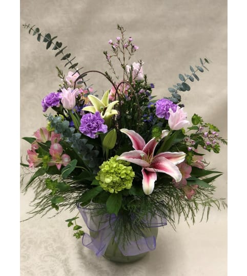 Lush Garden Mix in Rio Optic Glass. An arrangement by Blooming Boutique Florist.