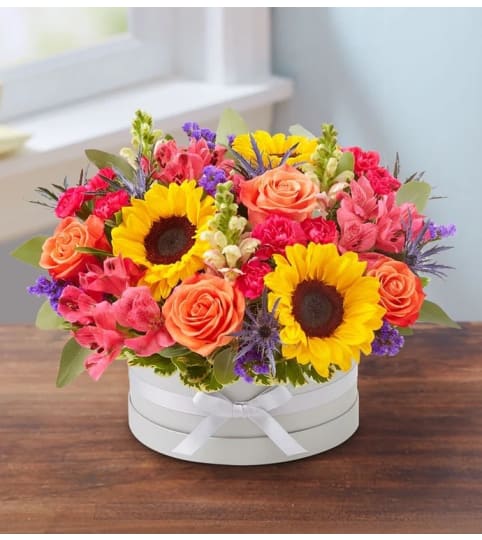 Bountiful Hatbox. An arrangement by L and J Blooms.