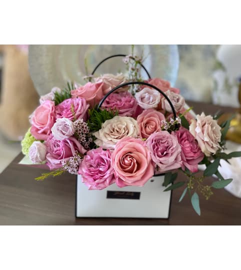 Blooming Rose Purse. An arrangement by Floral Lady Design Studio LLC.