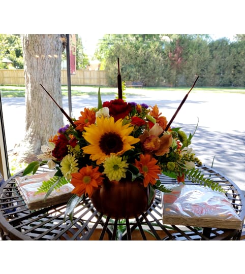 Ceramic Pumpkin Tablecentre. An arrangement by Loyalist Flowers.