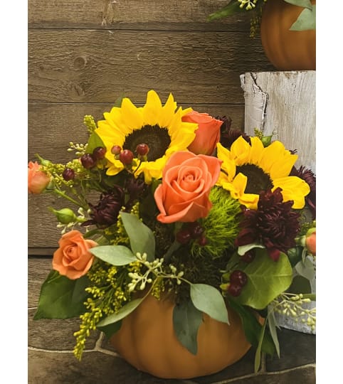 Ceramic Harvest Pumpkin. An arrangement by Donato's Floral.