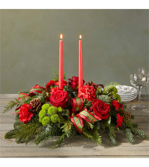BY THE CANDLELIGHT CENTERPIECE by Connys flowers SHOP. An arrangement by Conny's Flower Shop.