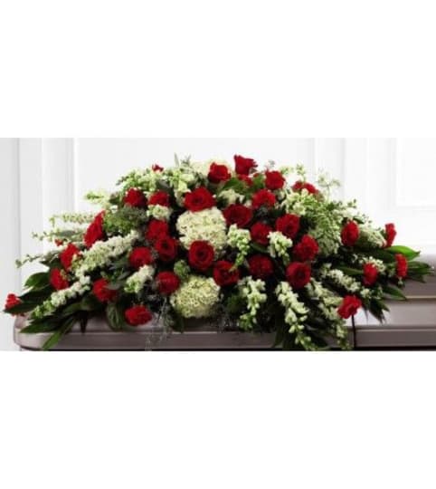 CASKET SPRAY MASCULINE. An arrangement by Brasco Florist.