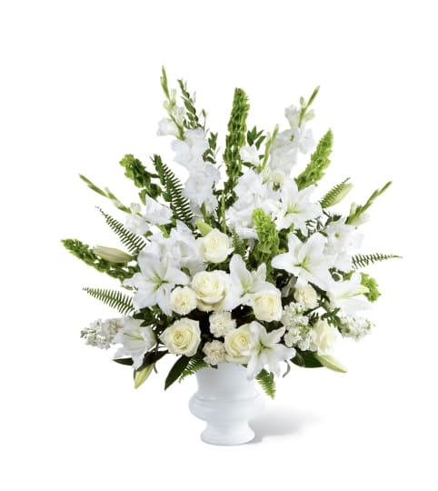 WHITE SYMPATHY URN. An arrangement by Brasco Florist.