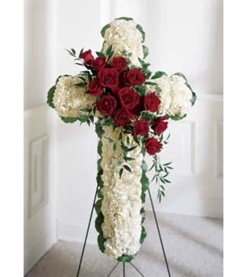 EASEL CROSS. An arrangement by Brasco Florist.