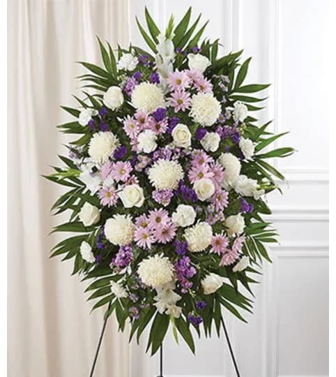 PURPLE LAVENDER WHITE COMPASSION SPRAY. An arrangement by Brasco Florist.