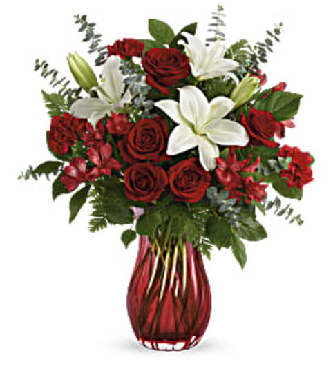 Love Conquer All. An arrangement by Palmetto Gardens Florist.