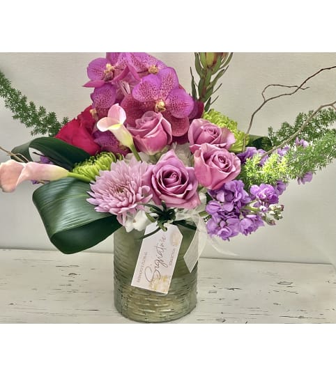 Pretty in Lavenders Signature. An arrangement by Donato's Floral.