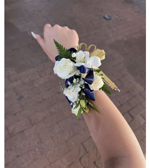 Blue and White Corsage. An arrangement by Rose Flowers.