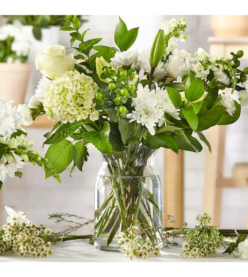 Classic Ivory – A Florist Original. An arrangement by Conny's Flower Shop.