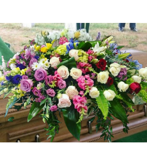 The Garden Path Casket Spray. An arrangement by Loyalist Flowers.