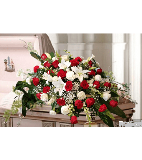 Classic Red and White Casket Spray. An arrangement by Loyalist Flowers.