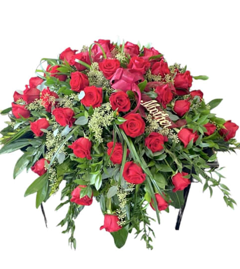 Elegance and Class Casket Spray. An arrangement by Loyalist Flowers.