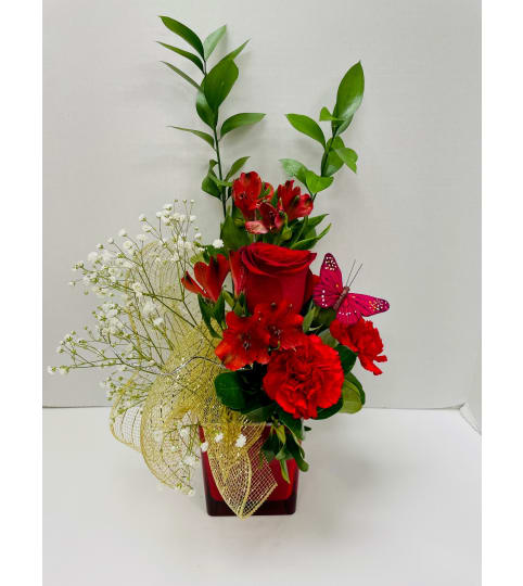 Colour Splash Flower Arrangement - Red. An arrangement by Balloon Bouquets Plus.