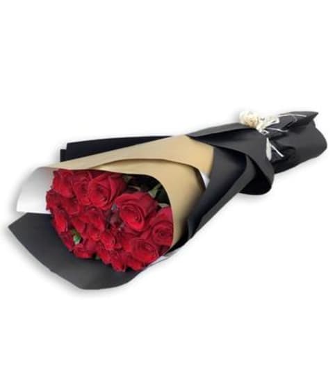 1dozen roses wrapped bouquet. An arrangement by BellaRosa Gardens.