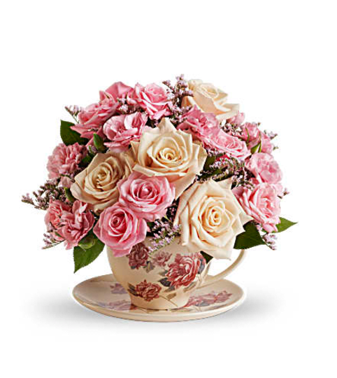 stylish tea cup. An arrangement by Fine's Flowers.