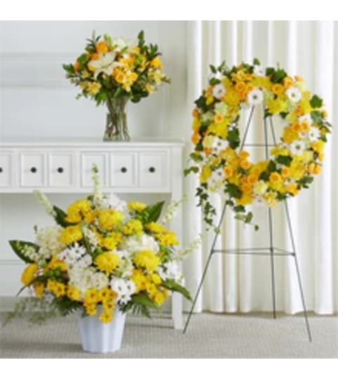 Warm Remembrance Bundles set. An arrangement by Conny's Flower Shop.