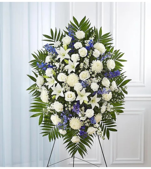 Garden Blue and White Standing spray. An arrangement by Garden Florist.