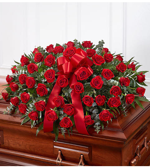 Garden Casket Spray All Red Roses. An arrangement by Garden Florist.