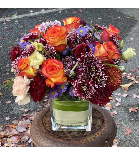 Sunrise Floral Arrangement. An arrangement by Violeta's Flower Shop.