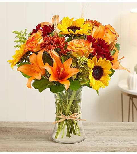 FALLIN' BLOOMS. An arrangement by Howard Beach Florist.