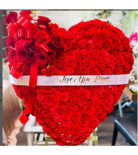 FILLED RED HEART. An arrangement by Geni's Florist and Gifts.