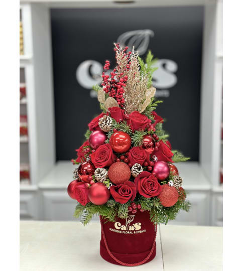 Antonela Christmas Tree Box. An arrangement by Cala's Boutique Floral.