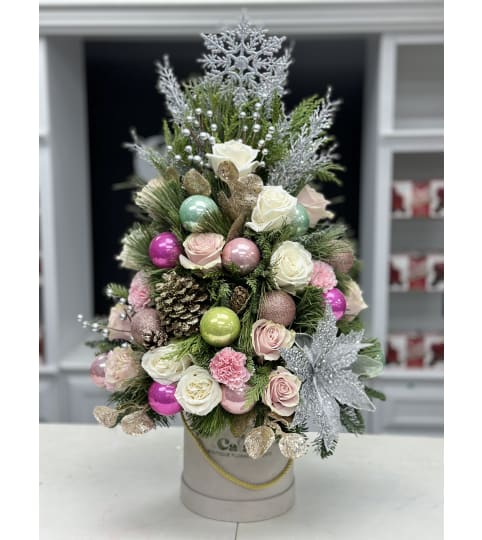Magic World Christmas Tree Box. An arrangement by Cala's Boutique Floral.