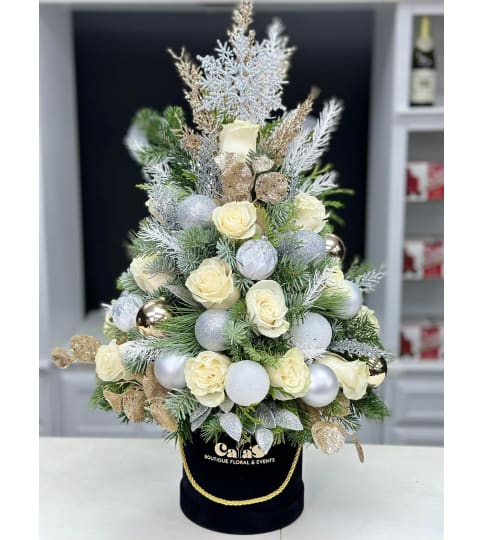 Christmas Tree Box *Christmas White*. An arrangement by Cala's Boutique Floral.