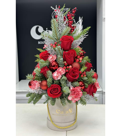 Candy Christmas Tree Box. An arrangement by Cala's Boutique Floral.
