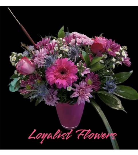 Designers Choice Vase Arrangement. An arrangement by Loyalist Flowers.