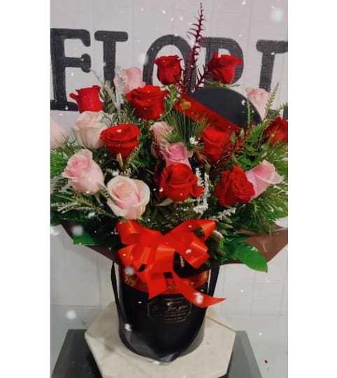 Pink and Red Roses box. An arrangement by Geni's Florist and Gifts.